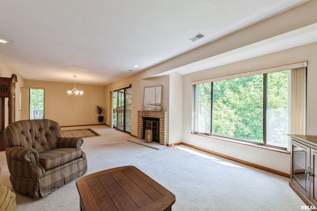 2200 36th Ave Unit 2D, Rock Island, IL 61201 - living area featuring light carpet, a chandelier, a fireplace, and recessed lighting