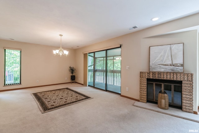 2200 36th Ave Unit 2D, Rock Island, IL 61201 - unfurnished living room with carpet floors, a chandelier, and a brick fireplace