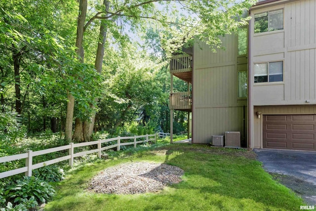 2200 36th Ave Unit 2D, Rock Island, IL 61201 - view of yard featuring a balcony, driveway, and a garage