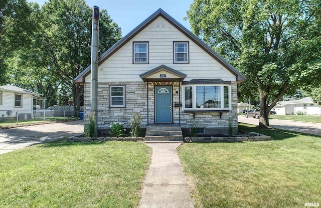 1221 4th St, Camanche, IA 52730 - bungalow-style home featuring stone siding