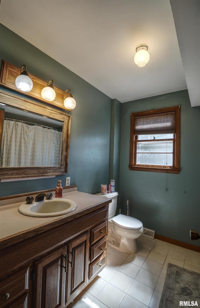1221 4th St, Camanche, IA 52730 - bathroom featuring tile patterned floors and vanity