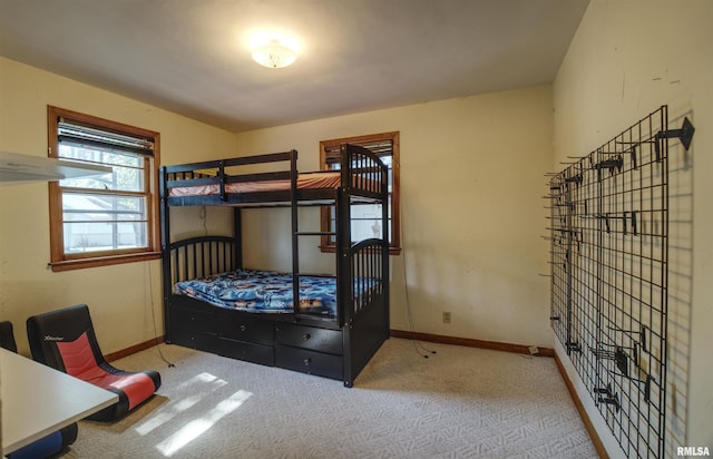 1221 4th St, Camanche, IA 52730 - bedroom with carpet floors and baseboards