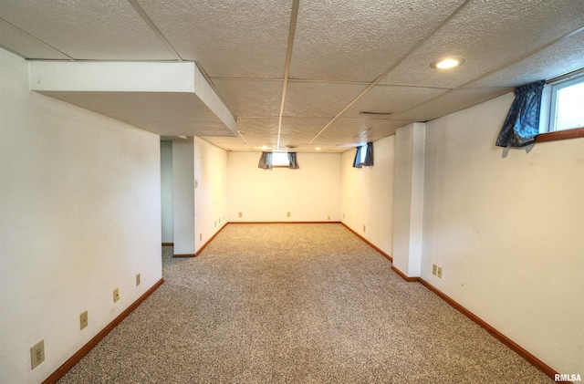 1221 4th St, Camanche, IA 52730 - below grade area featuring carpet floors and baseboards