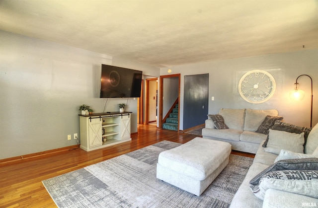 1221 4th St, Camanche, IA 52730 - living area featuring stairway and wood finished floors
