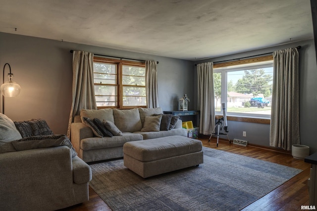 1221 4th St, Camanche, IA 52730 - living area featuring hardwood / wood-style flooring and baseboards