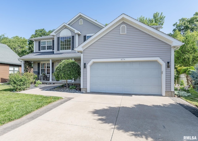 624 Mineral Creek Dr, Colona, IL 61241 - traditional-style home with driveway, a garage, and a porch