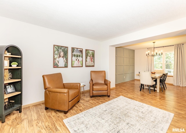 624 Mineral Creek Dr, Colona, IL 61241 - living area featuring a chandelier and light wood-style floors