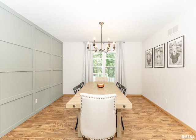 624 Mineral Creek Dr, Colona, IL 61241 - dining area featuring a chandelier and light wood-type flooring