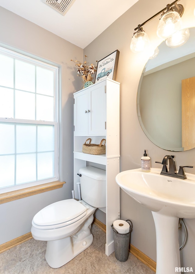 624 Mineral Creek Dr, Colona, IL 61241 - half bathroom featuring toilet and tile patterned flooring