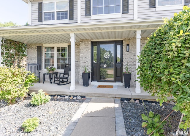 624 Mineral Creek Dr, Colona, IL 61241 - property entrance with a porch and brick siding