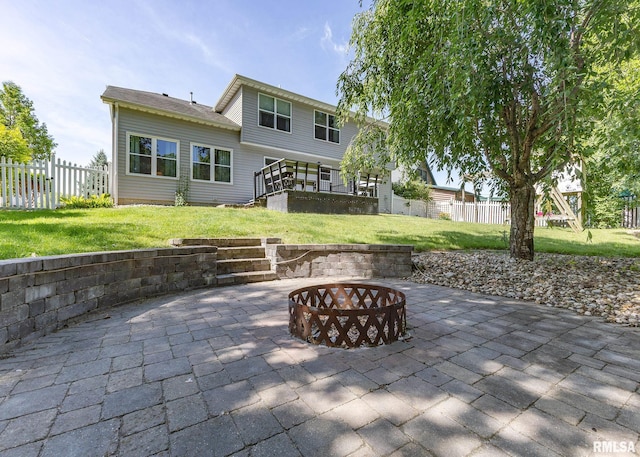 624 Mineral Creek Dr, Colona, IL 61241 - back of house with a fire pit and a patio area