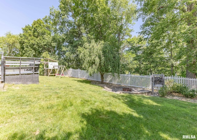 624 Mineral Creek Dr, Colona, IL 61241 - fenced backyard with a playground, a fire pit, and a deck