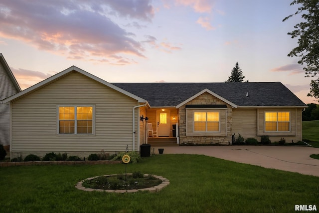 106 Valley View Dr, Sherrard, IL 61281 - ranch-style house with a lawn, stone siding, and roof with shingles