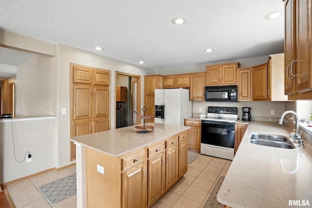 106 Valley View Dr, Sherrard, IL 61281 - kitchen with white appliances, light tile patterned floors, a center island, washer / dryer, and recessed lighting