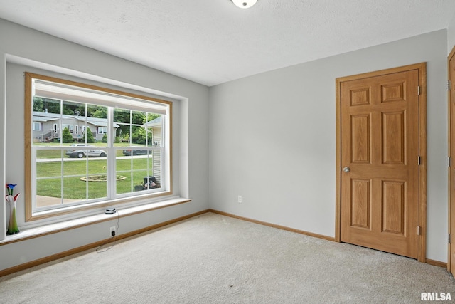 106 Valley View Dr, Sherrard, IL 61281 - carpeted empty room with baseboards