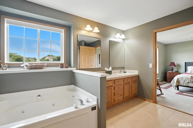 106 Valley View Dr, Sherrard, IL 61281 - full bathroom with vanity, ensuite bath, a jetted tub, and tile patterned flooring