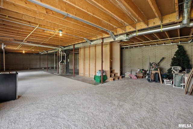 106 Valley View Dr, Sherrard, IL 61281 - unfinished basement featuring heating unit and stairway