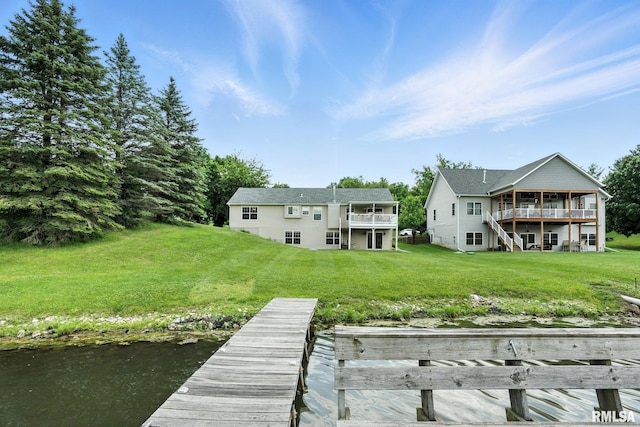 106 Valley View Dr, Sherrard, IL 61281 - back of house featuring a lawn, a deck with water view, and stairway