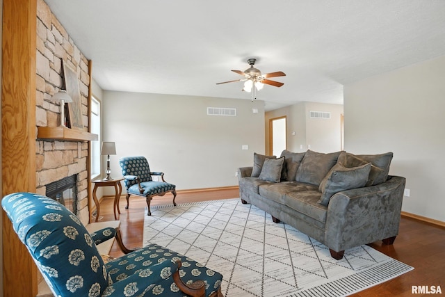 106 Valley View Dr, Sherrard, IL 61281 - living area featuring ceiling fan, light wood-style flooring, and a fireplace