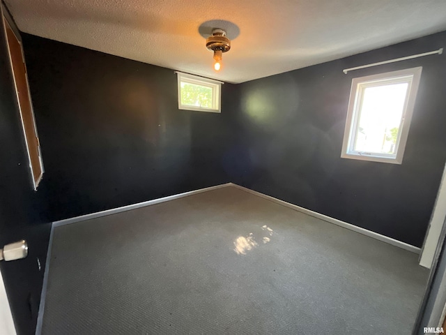 915 S 5th St, Clinton, IA 52732 - carpeted empty room featuring baseboards