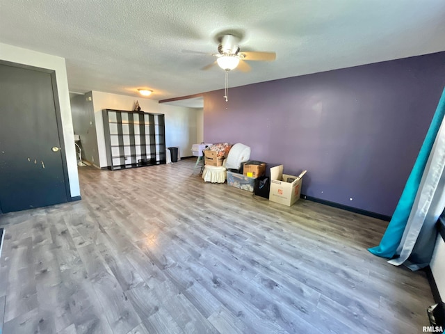 915 S 5th St, Clinton, IA 52732 - unfurnished room with a ceiling fan, wood finished floors, and a textured ceiling