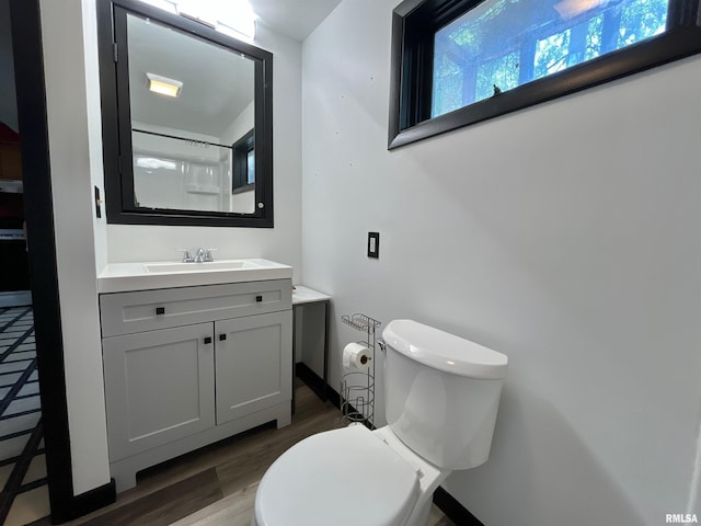 915 S 5th St, Clinton, IA 52732 - bathroom with vanity and wood finished floors