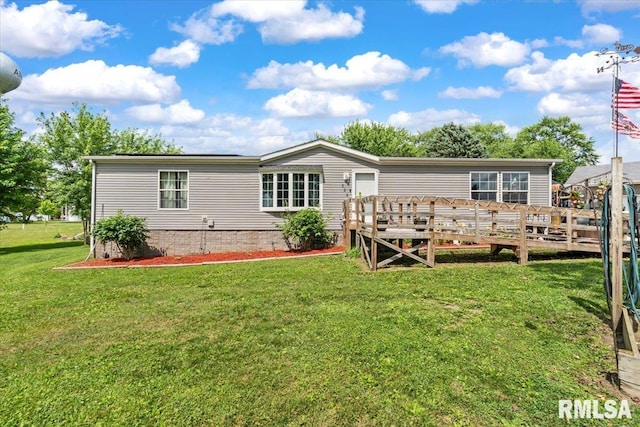 524 6th St, Andover, IL 61233 - rear view of house with a deck and a yard
