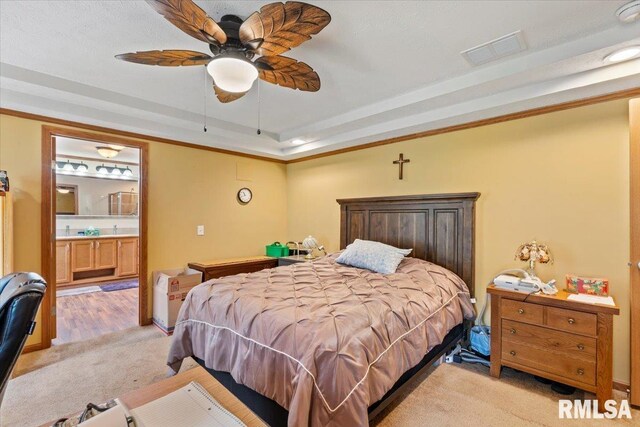 524 6th St, Andover, IL 61233 - bedroom with light colored carpet, a raised ceiling, ensuite bathroom, ceiling fan, and crown molding