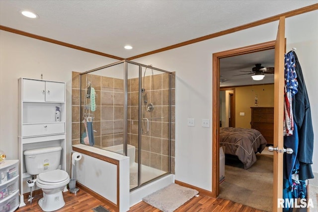 524 6th St, Andover, IL 61233 - bathroom with ornamental molding, wood finished floors, a shower stall, ensuite bath, and a textured ceiling