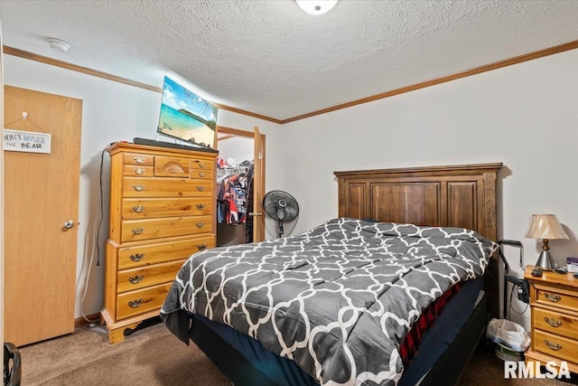 524 6th St, Andover, IL 61233 - bedroom with crown molding, carpet floors, a spacious closet, a closet, and a textured ceiling