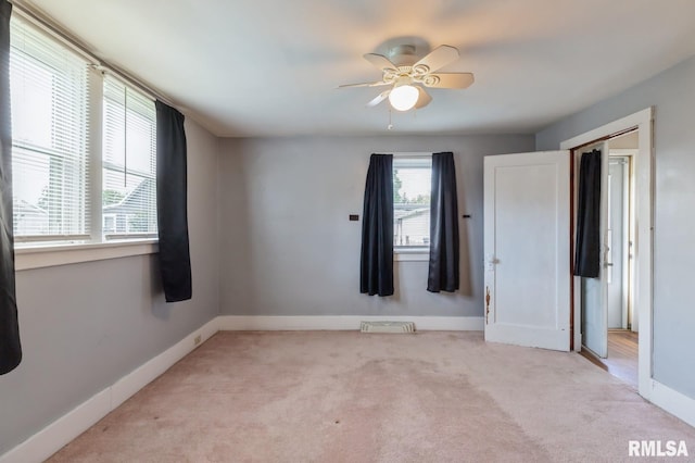 2511 N 4th St, Clinton, IA 52732 - unfurnished bedroom with light colored carpet and baseboards