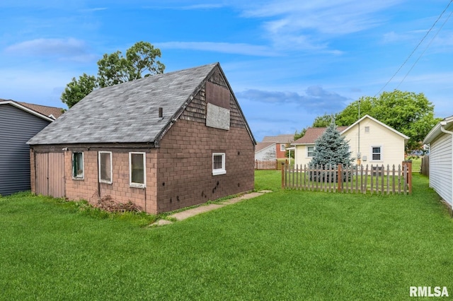 2511 N 4th St, Clinton, IA 52732 - view of side of property with a shingled roof