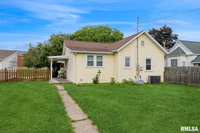 2511 N 4th St, Clinton, IA 52732 - back of house featuring a fenced backyard and roof with shingles