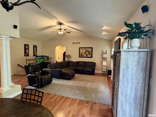 310 Westminster Rd, Germantown Hills, IL 61548 - living area featuring arched walkways, ornate columns, vaulted ceiling, wood finished floors, and a ceiling fan