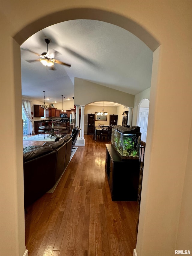 310 Westminster Rd, Germantown Hills, IL 61548 - corridor featuring arched walkways, dark wood-style floors, and a chandelier
