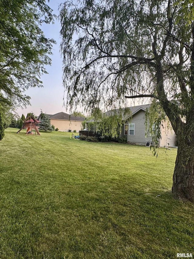 310 Westminster Rd, Germantown Hills, IL 61548 - view of grassy yard featuring a playground