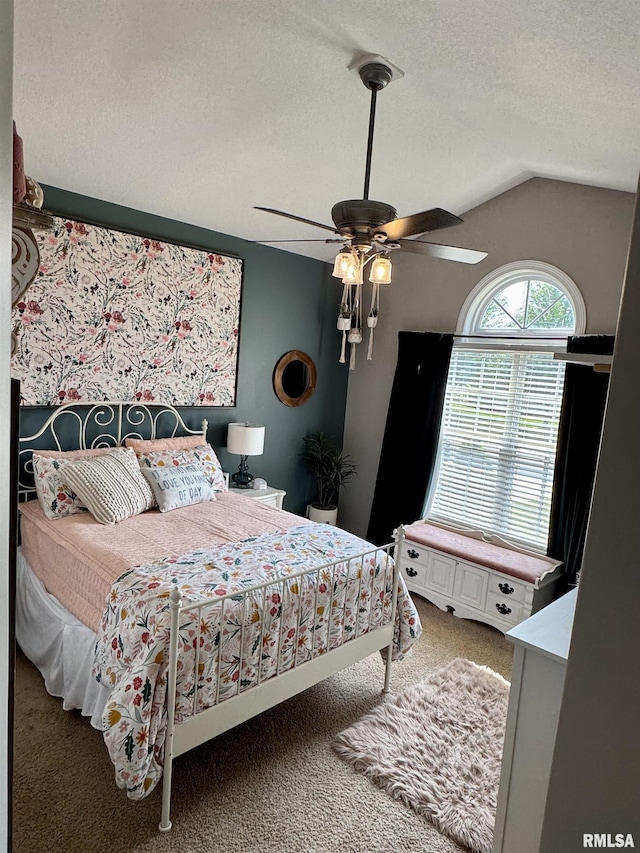 310 Westminster Rd, Germantown Hills, IL 61548 - carpeted bedroom featuring a textured ceiling, vaulted ceiling, and ceiling fan