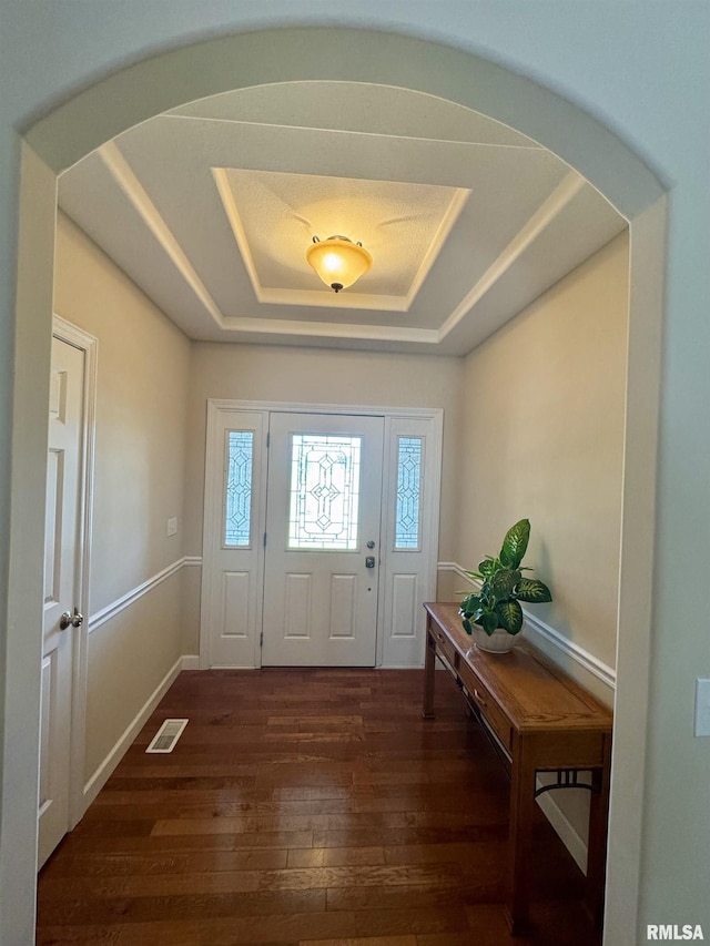 310 Westminster Rd, Germantown Hills, IL 61548 - foyer featuring a raised ceiling, plenty of natural light, arched walkways, and hardwood / wood-style floors
