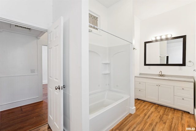 107 S High St, Port Byron, IL 61275 - full bath with wood finished floors, vanity, and shower / bathtub combination