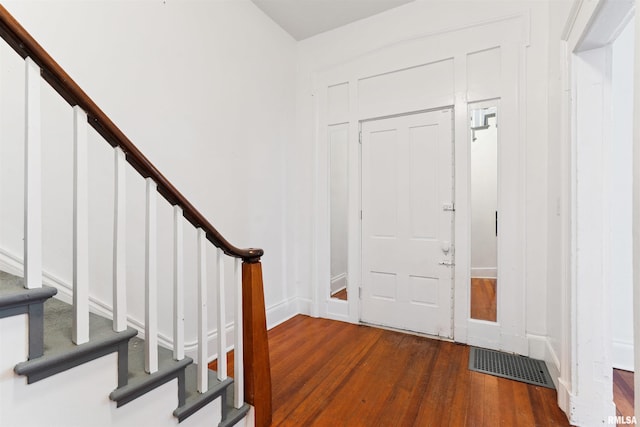 107 S High St, Port Byron, IL 61275 - foyer entrance featuring dark wood-style flooring and stairs