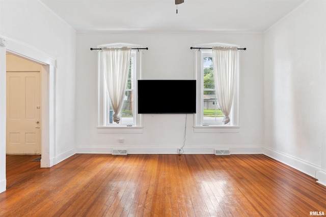 107 S High St, Port Byron, IL 61275 - unfurnished living room with light wood-type flooring and a ceiling fan