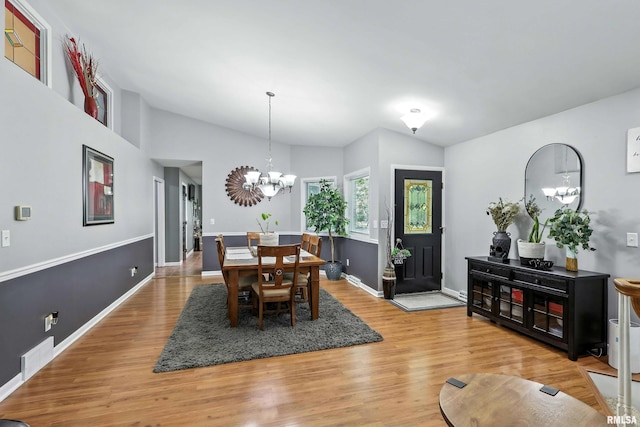885 47th Ave, East Moline, IL 61244 - dining space featuring light wood-style flooring and a chandelier