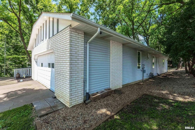 885 47th Ave, East Moline, IL 61244 - view of property exterior with a garage and brick siding