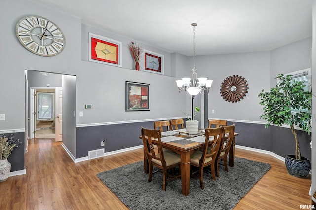 885 47th Ave, East Moline, IL 61244 - dining room featuring a chandelier and wood finished floors