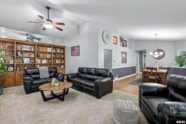 885 47th Ave, East Moline, IL 61244 - living area with a chandelier, a ceiling fan, light colored carpet, light wood-style floors, and lofted ceiling