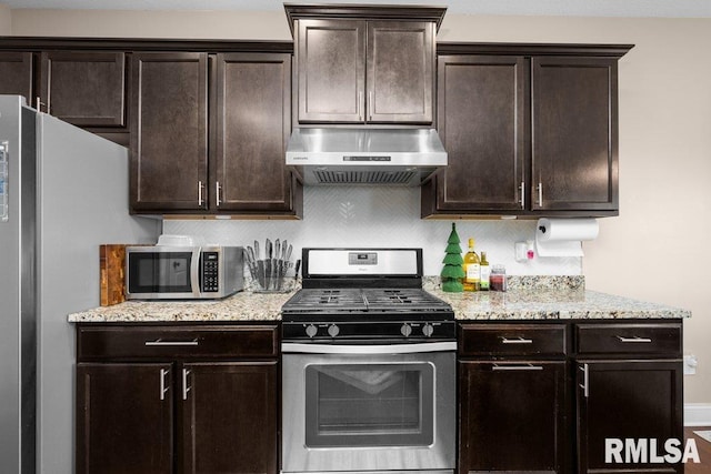 67 Cobblestone Ln, Le Claire, IA 52753 - kitchen with stainless steel appliances, exhaust hood, and dark brown cabinets