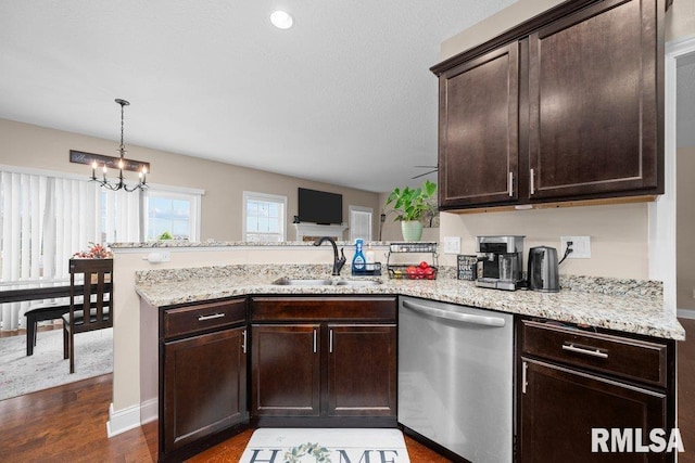 67 Cobblestone Ln, Le Claire, IA 52753 - kitchen with dishwasher, a peninsula, dark brown cabinetry, a chandelier, and light stone countertops