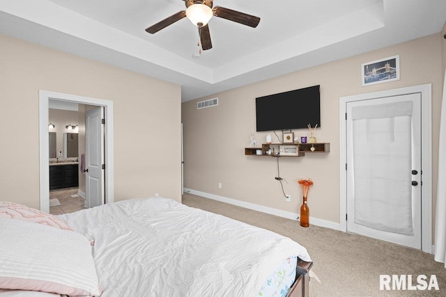 67 Cobblestone Ln, Le Claire, IA 52753 - carpeted bedroom with a raised ceiling, ensuite bath, and a ceiling fan