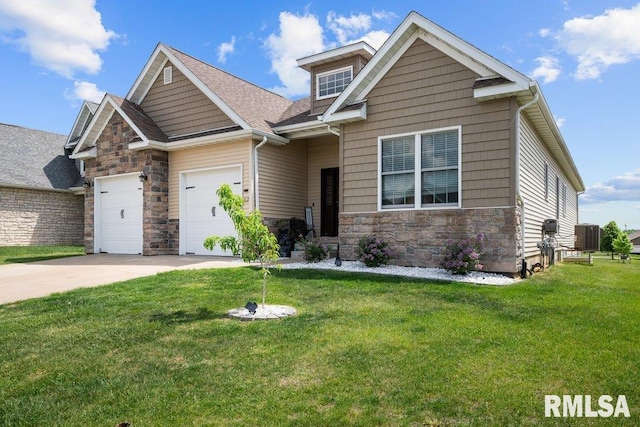 67 Cobblestone Ln, Le Claire, IA 52753 - craftsman inspired home featuring stone siding, a front lawn, an attached garage, and driveway