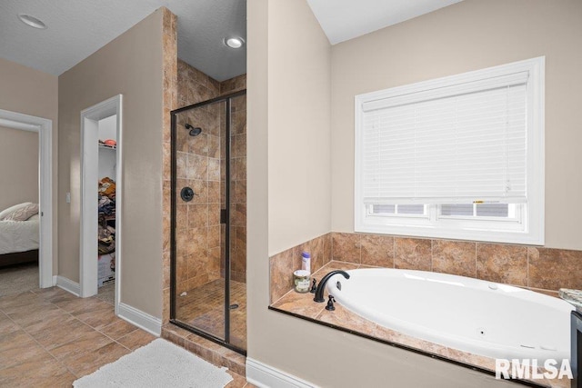 67 Cobblestone Ln, Le Claire, IA 52753 - ensuite bathroom featuring a bath and a stall shower